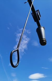 Low angle view of street light against sky