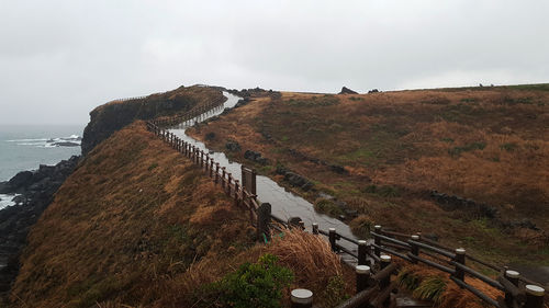 Panoramic view of land and sea against sky