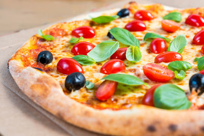 Close-up of fresh pizza served on plate