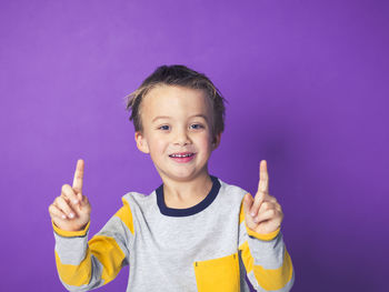 Boy against purple background