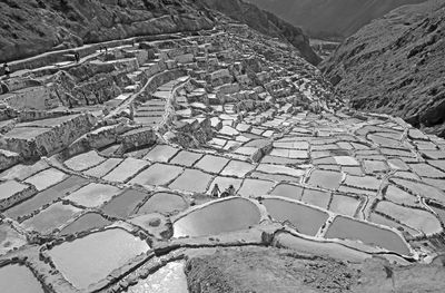 Monochrome image of salineras de maras, a historic salt mines in the canyon, cusco region, peru