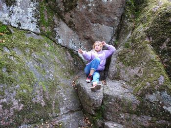 Full length of girl on rock