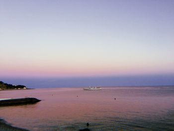 Scenic view of sea against clear sky during sunset