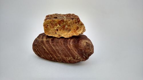 Close-up of bread against white background