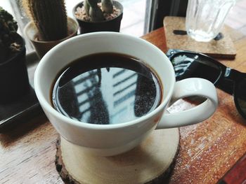 High angle view of coffee cup on table