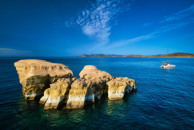 Panoramic view of sea against blue sky