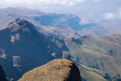 Aerial view of snowcapped mountains against sky