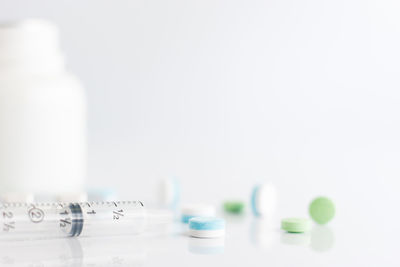 Close-up of bottles against white background