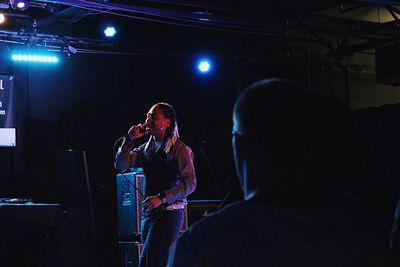 Rear view of man sitting at music concert