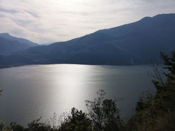 Scenic view of lake and mountains against sky