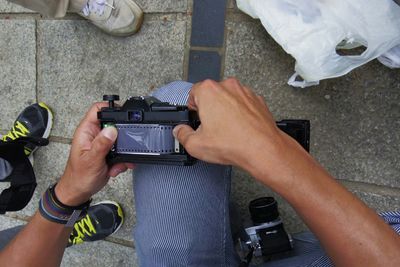 Young woman photographing through smart phone