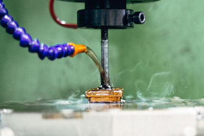 Close-up of water on machinery