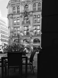 Chairs and table against building