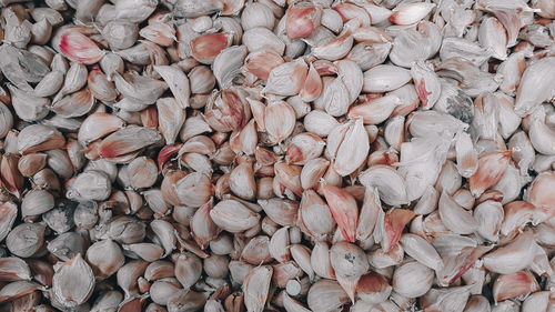 Full frame shot of garlic for sale at market