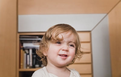 Close-up of cute girl at home