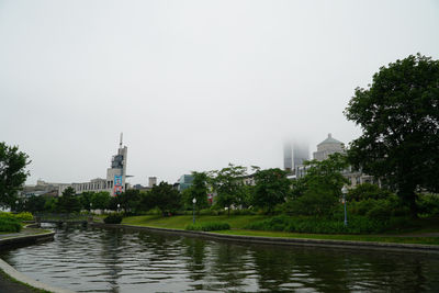 View of mosque and city against sky