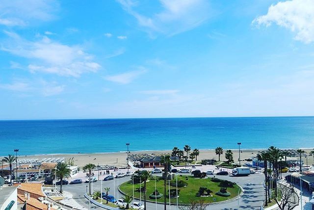 sea, horizon over water, water, transportation, sky, mode of transport, nautical vessel, blue, beach, car, nature, built structure, boat, beauty in nature, cloud - sky, high angle view, day, building exterior, scenics, incidental people