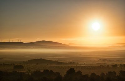 Scenic view of landscape against sky during sunset