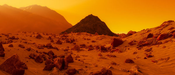 Scenic view of mountains against sky during sunset