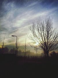 Scenic view of field against sky at sunset