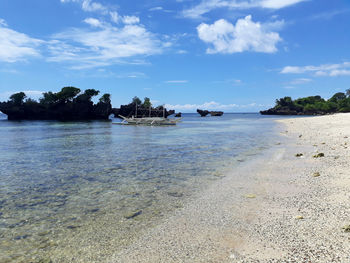 Scenic view of beach against sky