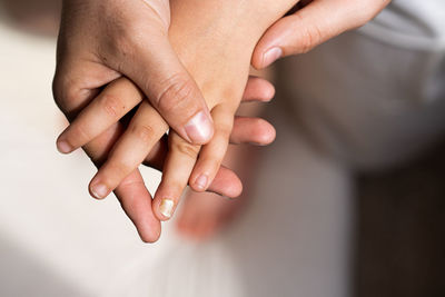 A boy's hand with a chipped nail.