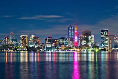 Illuminated city at waterfront