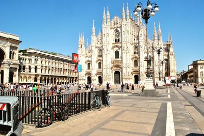 Group of people in front of buildings in city duomo milano 