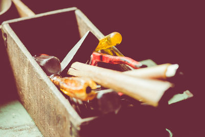 Close-up of cake on table against black background