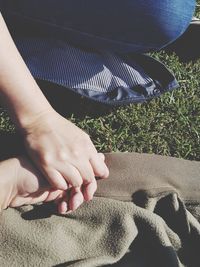 Low section of woman legs on grass