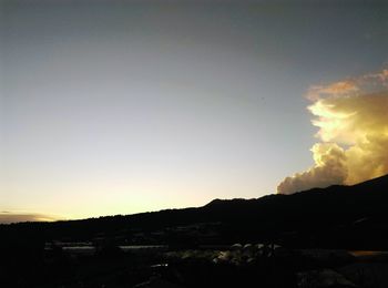 Scenic view of silhouette mountains against clear sky