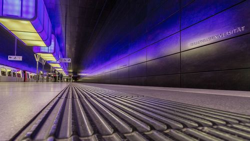 View of railroad station platform at night