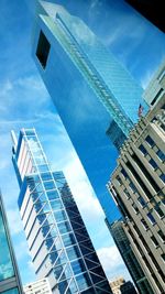 Low angle view of modern buildings against sky