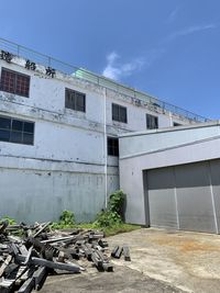 Low angle view of abandoned building against sky