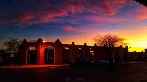 View of empty road against sunset sky