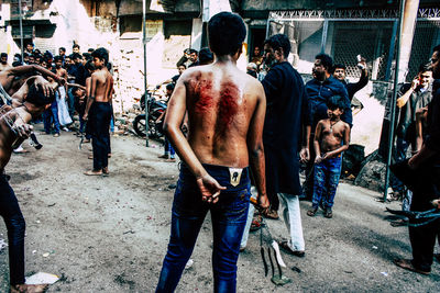 People standing on street in city