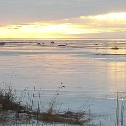 Scenic view of sea at sunset