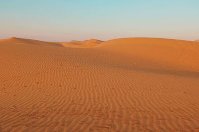 Scenic view of desert against clear sky