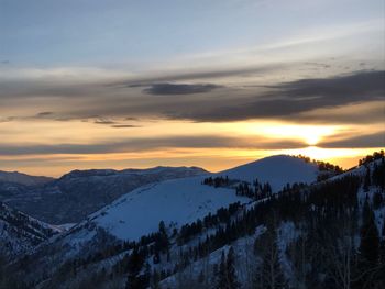Scenic view of mountains against sky during sunset