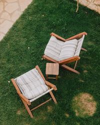 Empty chairs on field