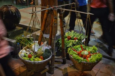 Low section of man with vegetables for sale in market