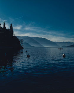 Scenic view of lake against blue sky