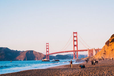 View of suspension bridge against clear sky