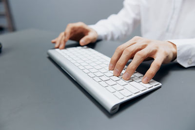 Midsection of businessman sitting office