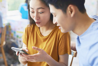 Portrait of young man using mobile phone