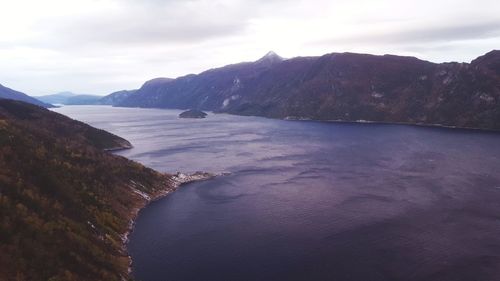 Scenic view of mountains and sea against sky