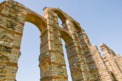 Low angle view of old ruins against clear sky