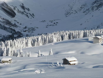 Scenic view of snow covered landscape against sky