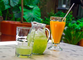 Close-up of cocktail in containers on table