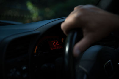 Close-up of man driving car